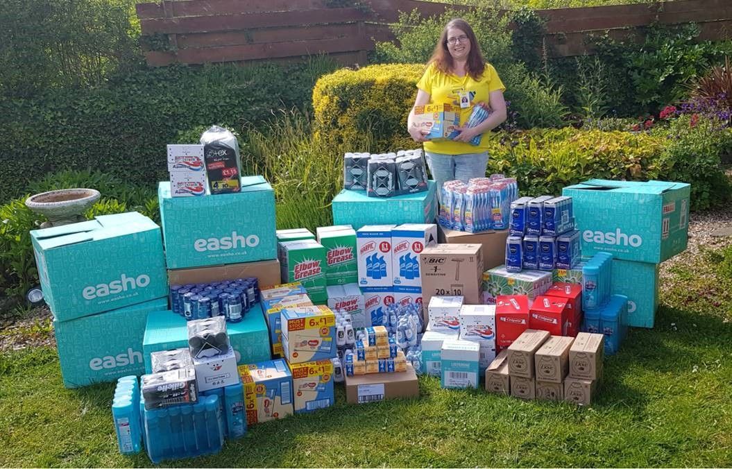 Woman standing in front of hygiene supplies