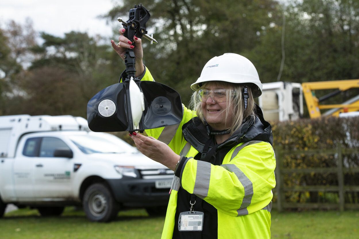 WPD engineer holding bird deterrent