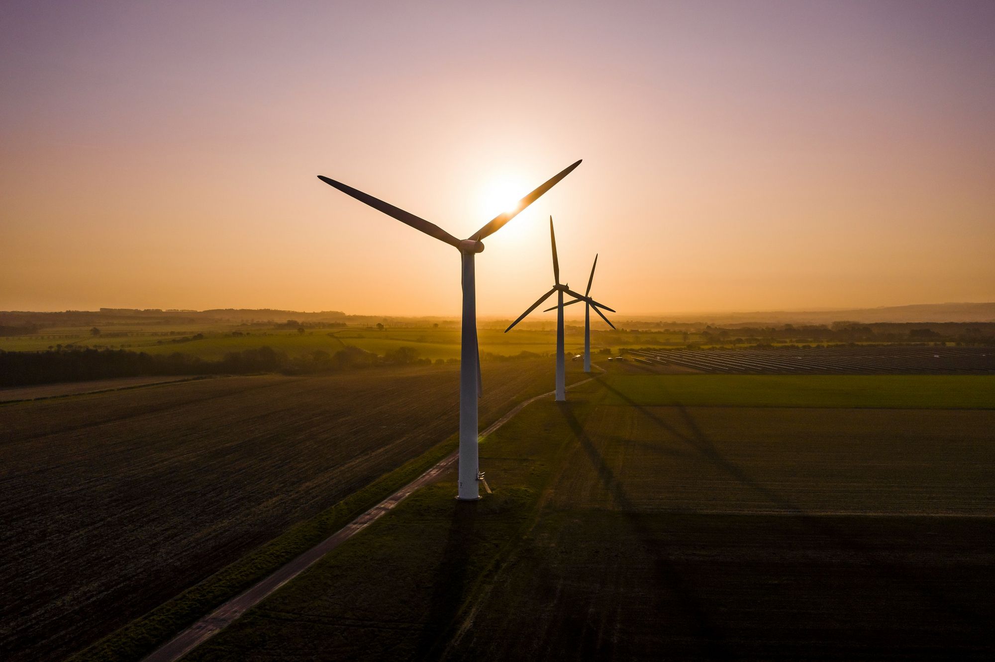 Wind turbines at sunset