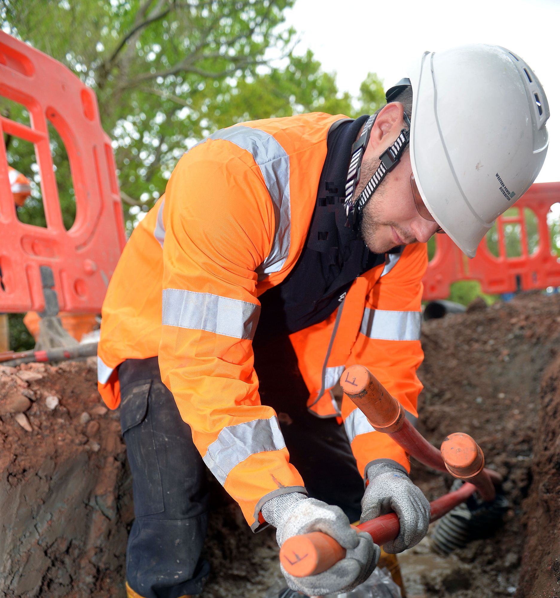 Western Power technician working on underground cables