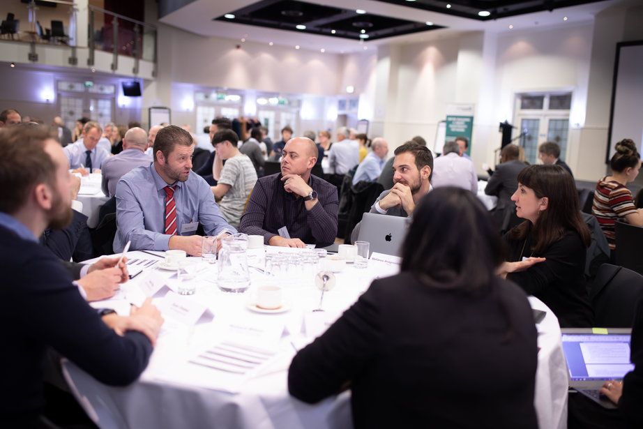 Corporate colleagues sitting around a conference table